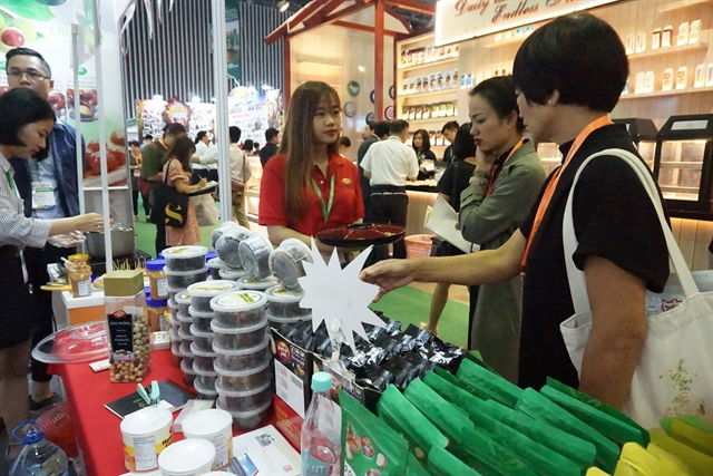 Visitors at the VietFood, Beverage and Professional Packing Machines international exhibition that opened in HCM City on August 7. (Photo: VNS/Thu Hang)
