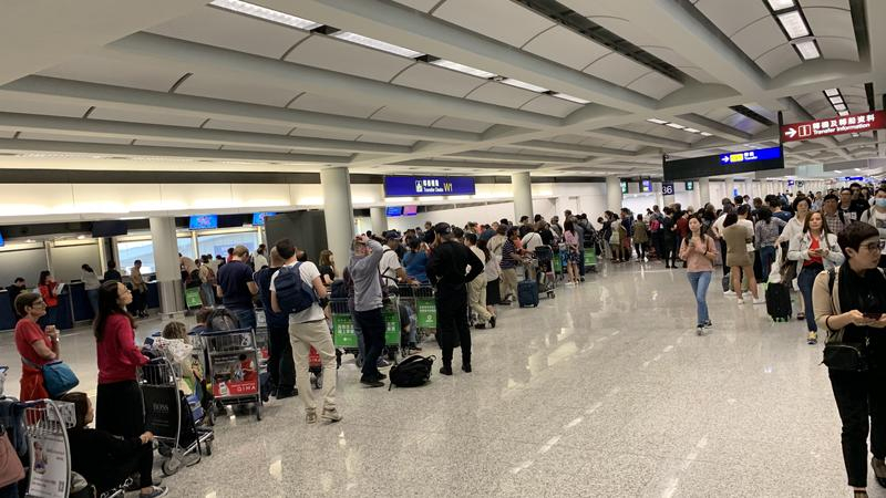 HK airport reopens but protesters pour in again HK airport reopens but protesters pour in again