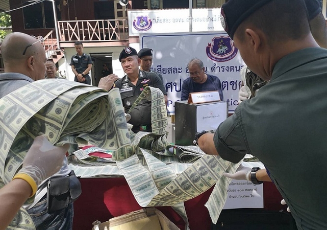 Chiang Rai woman arrested over fake US dollars Chiang Rai woman arrested over fake US dollars