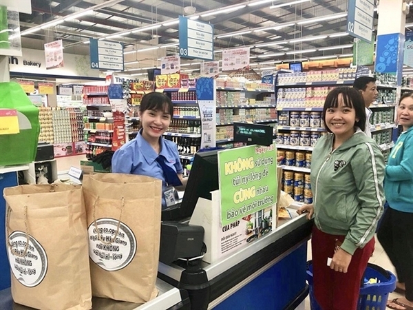 A 'No plastic bag day' campaign at a Saigon Co.op shop. The circular economy provides a golden opportunity for businesses. — VNS Photo
