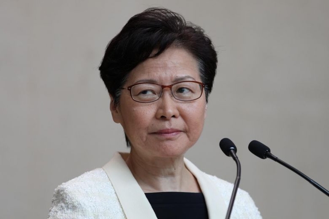 Hong Kong leader Carrie Lam faces critics at town hall amid protest outside venue Hong Kong leader Carrie Lam faces critics at town hall amid protest outside venue