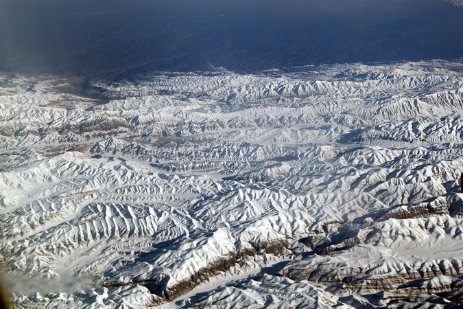 A view of the Hindu Kush mountain range from 35,000 feet. The range divides Central Asia from South Asia. (Photo: iStock)