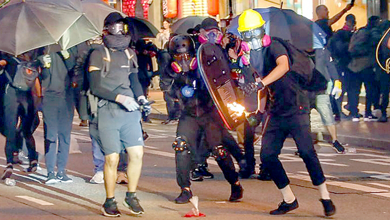 Hong Kong adopts anti-mask law to quell violence Hong Kong adopts anti-mask law to quell violence