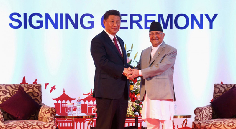 Chinese President Xi Jinping (left) and Prime Minister KP Sharma Oli shake hands after signing the agreements in Kathmandu on Sunday