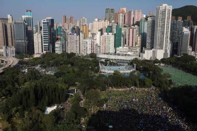 Clashes in Hong Kong after thousands gather for banned rally; Xinhua News Agency office vandalised Clashes in Hong Kong after thousands gather for banned rally; Xinhua News Agency office vandalised