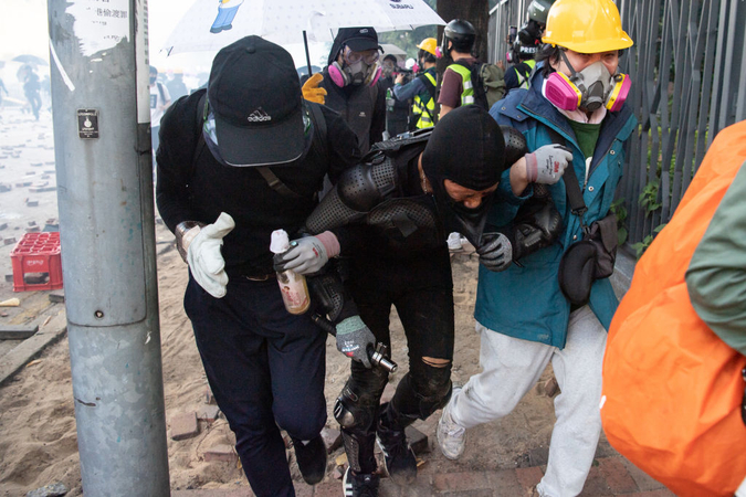 File photo:Anti-Government Protests in Hong Kong

HONG KONG, CHINA - NOVEMBER 18: Anti-government protesters carry an injured person away during clashes with police at Hong Kong Polytechnic University on November 18, 2019 in Hong Kong, China. Anti-government protesters organized a general strike since Monday as demonstrations in Hong Kong stretched into its sixth month with demands for an independent inquiry into police brutality, the retraction of the word 