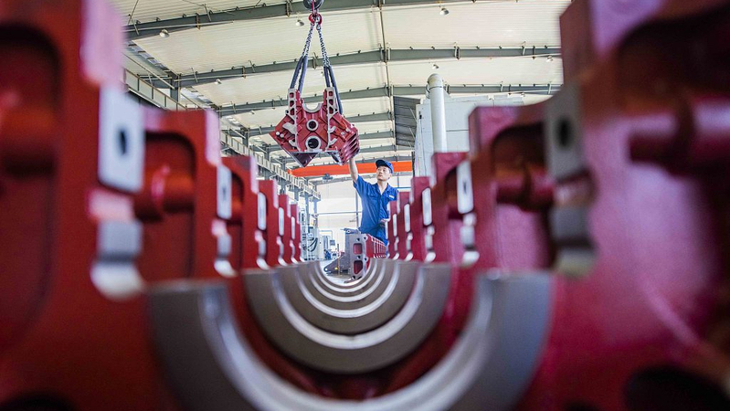 An engineer checks machines in Weifang of Shandong province, China, August 31, 2019. [Photo/VCG]