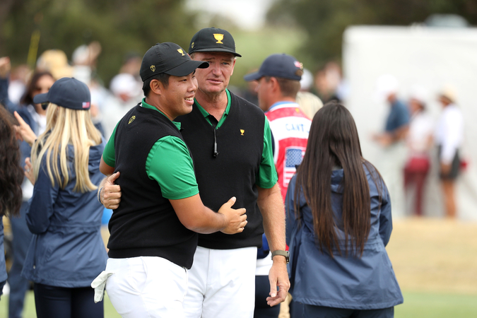 Byeong Hun An with captain Ernie Els