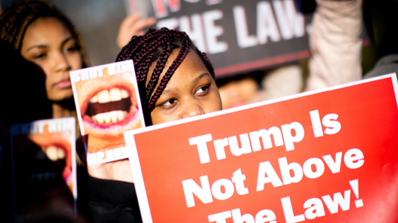 Jamiya London, 16, of Washington, holds a sign at the event. MUST CREDIT: Washington Post photo by Sarah L. Voisin
