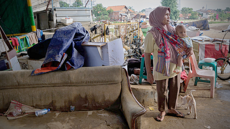 Massive Floods Hit Indonesia's Capital City

JAKARTA, INDONESIA - JANUARY 03: An Indonesian woman stands next to salvaged furniture under a highway bridge after being displaced from her home in a flooded neighborhood on January 3, 2020 in Jakarta, Indonesia. Flooding caused by heavy rainfall has left at least 43 people dead and hundreds of thousands displaced from their homes. With more rain forecast, the authorities are using the technique of cloud seeding in an attempt to ease flooding in the capital. (Photo by Ed Wray/Getty Images)