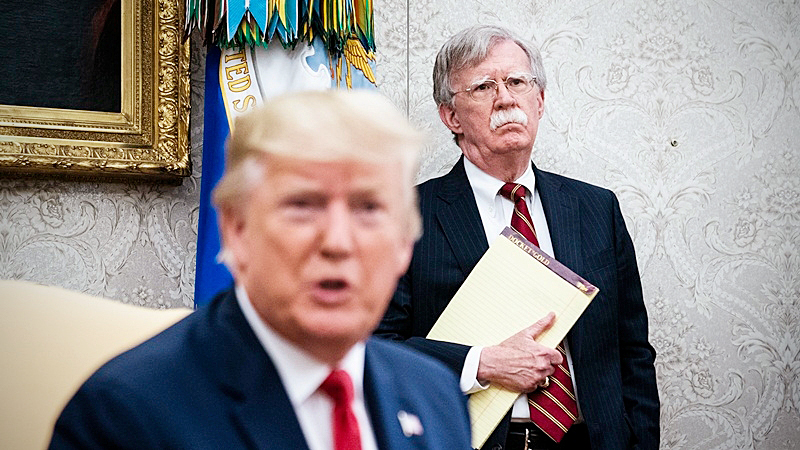 John Bolton listens to President Donald Trump in the White House in July 2019. MUST CREDIT: Washington Post photo by Jabin Botsford