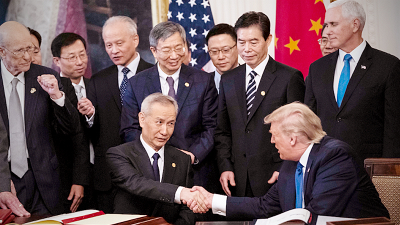 President Donald Trump signs a trade agreement with Chinese Vice Premier Liu He at the White House on Wednesday, Jan. 15, 2020. MUST CREDIT: Washington Post photo by Jabin Botsford