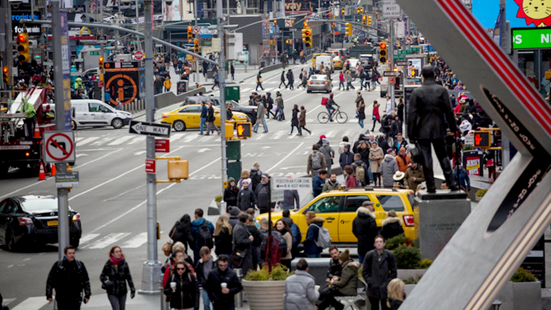 Pedestrians walk though Times Square in New York on Feb. 22, 2019. MUST CREDIT: Bloomberg photo by Michael Nagle,