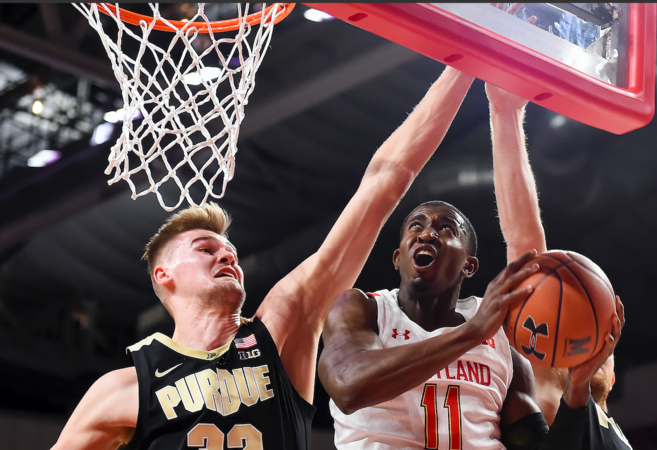 Maryland forward Darryl Morsell puts up a shot as Purdue's Matt Haarms defends during the first half of their game Saturday at Xfinity Center in College Park, Md. MUST CREDIT: Photo by Will Newton for The Washington Post