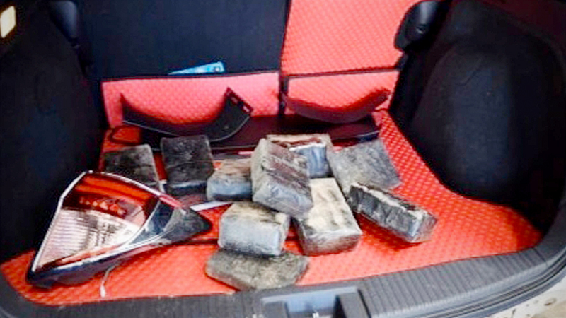 94,000 meth pills found hidden behind bumper of a car . 94,000 meth pills found hidden behind bumper of a car .