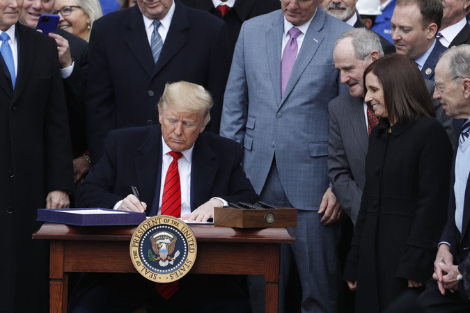 Trump signs USMCA, sealing political win with bipartisan deal Trump signs USMCA, sealing political win with bipartisan deal
