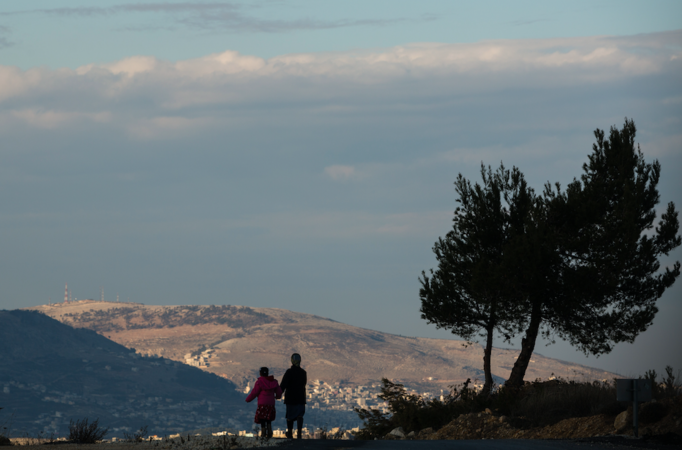 A Jewish mother and her daughter walk in the West Bank Jewish settlement of Eli along a road with a view of Palestinian villages. MUST CREDIT: Photo for The Washington Post by David Vaaknin