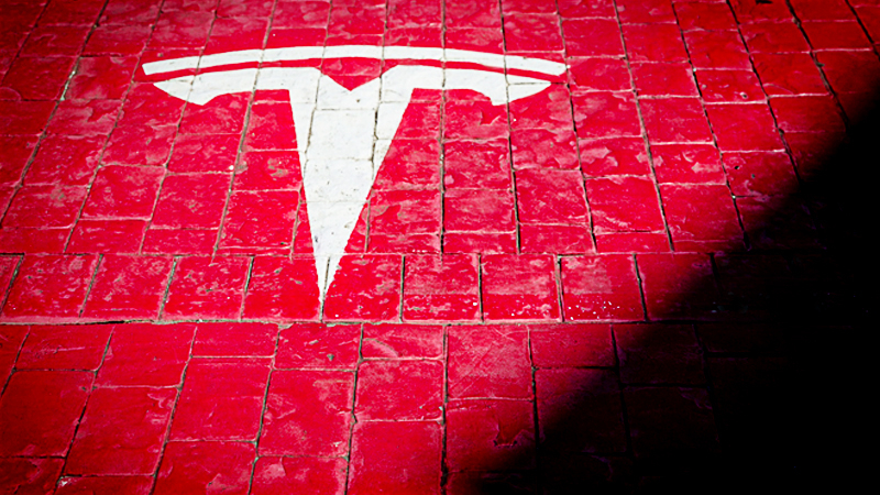 A Tesla logo marks a parking bay at a supercharger station in Girona, Spain, on July 10, 2019. MUST CREDIT: Bloomberg photo by Angel Garcia.