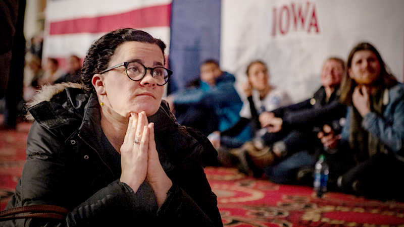 Mackenzie Mcilmail watches TV as she waits for results of the Iowa caucuses in Des Moines, on Monday, Feb. 3, 2020. MUST CREDIT: Washington Post photo by Salwan Georges
