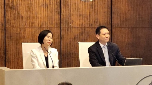 Finance Ministry spokesman Lavaron Sangsnit, right