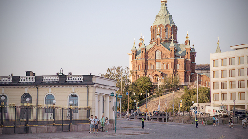 Pedestrians pass in front of the Uspenskin cathedral in Helsinki, Finland, on July 16, 2018. MUST CREDIT: Bloomberg photo by Chris Ratcliffe.
