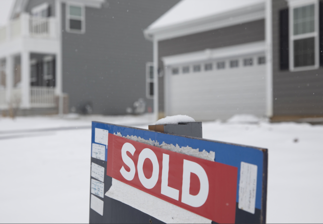 A sold sign is displayed outside a new home at the Toll Brothers Inc. Bowes Creek Country Club community in Elgin, Ill, on Jan. 23, 2020. MUST CREDIT: Bloomberg photo by Daniel Acker.