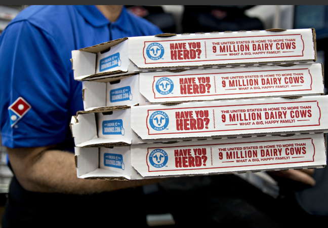 A employee moves pizza boxes before a delivery at a Domino's Pizza restaurant in Chantilly, Va., on Feb. 20, 2018. MUST CREDIT: Bloomberg photo by Andrew Harrer.