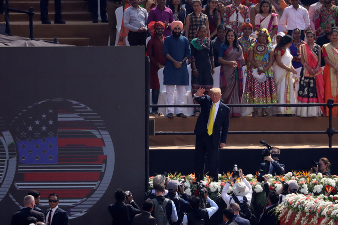 resident Donald Trump waves to the crowd during the 'Namaste Trump' event at the Motra Stadium in Ahmedabad, India, on Feb. 24, 2020. MUST CREDIT: Bloomberg photo by T. Narayan.