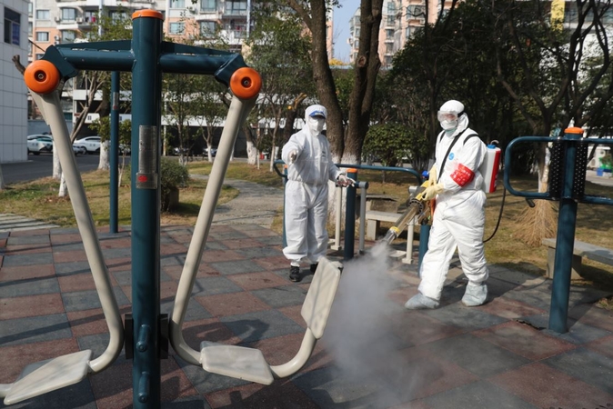 Blue Sky Rescue team members disinfect a community in Wuhan, Central China's Hubei province, Feb 22, 2020. [Photo by Wang Jing/chinadaily.com.cn] 