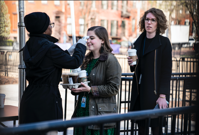 Hannah MacInnis and other White House staff members are stopped at a medical screening point on Monday, March 16, 2020. MUST CREDIT: Washington Post photo by Jabin Botsford

