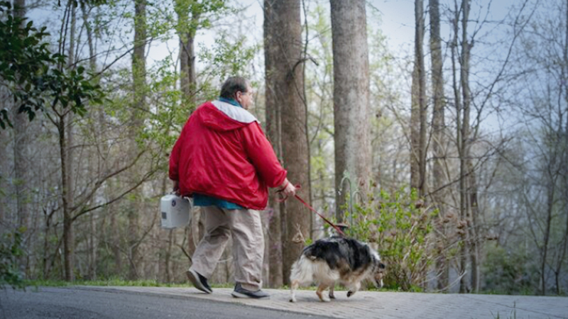 Dan Downs, 71, walks his dog Gracie at his home in Colonial Heights, Virginia, on Sunday, March 22, 2020. MUST CREDIT: Photo for The Washington Post by Julia Rendleman
