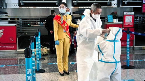 People in white full-body protective suits queueing to check-in at Tianhe International Airport in Wuhan, which reopened to departing passengers yesterday, after being closed for over two months.
Credit: ST PHOTO: ELIZABETH LAW