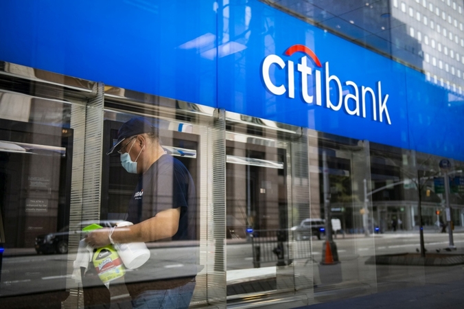 A worker cleans ATMs at a Citibank branch in New York on April 10, 2020. MUST CREDIT: Bloomberg photo by Mark Kauzlarich