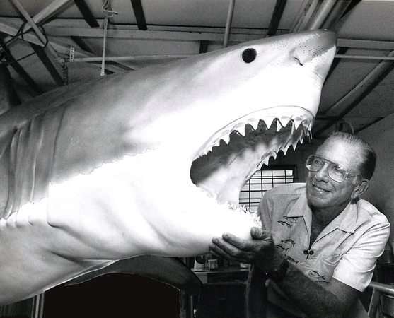 Jack Randall is pictured in 1991 with a model of a white shark at the Taronga Zoo in Sydney. MUST CREDIT: Photo courtesy of the Randall family