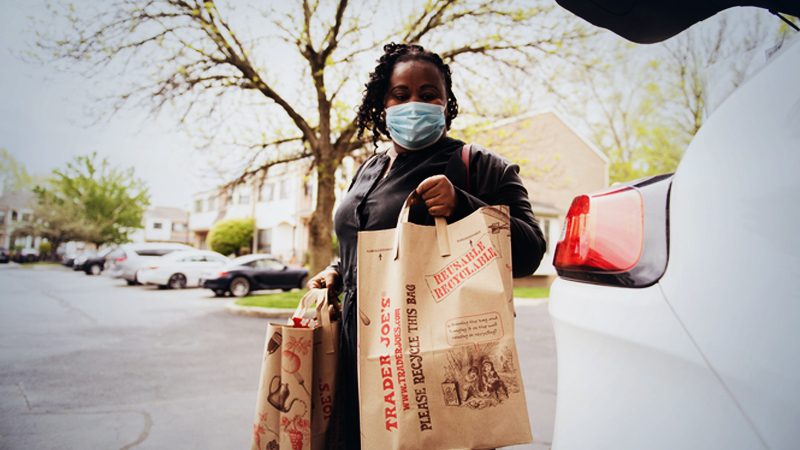 Ilanne Dubois, a 36-year-old single mother who was laid off in mid-March, completes her grocery shopping in New York. MUST CREDIT: photo for The Washington Post by Michael Noble, Jr.