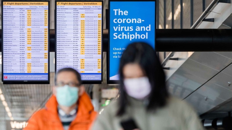 At the airport, expect plexiglass, face masks and long, long lines At the airport, expect plexiglass, face masks and long, long lines