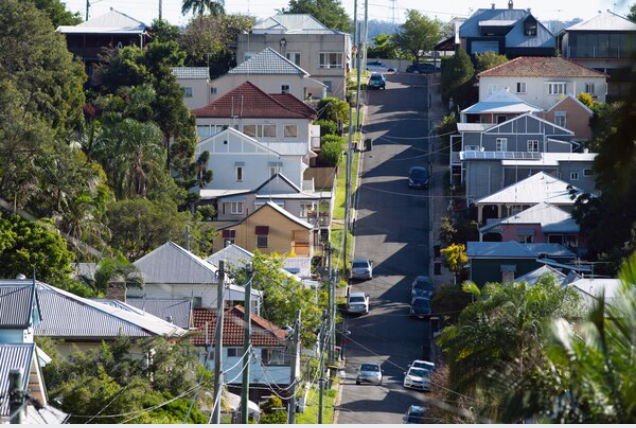 Residential properties stand along a street in Brisbane, Australia, on May 7, 2019. MUST CREDIT: Bloomberg photo by Ian Waldie.