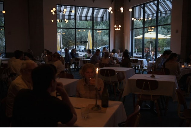 People dine at a restaurant after coronavirus restrictions were lifted in Houston on May 27, 2020. MUST CREDIT: Bloomberg photo by Callaghan O'Hare.