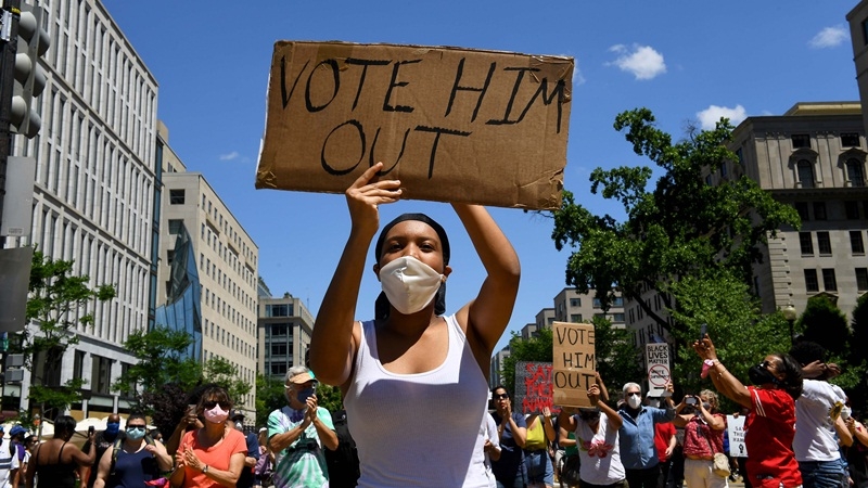 Tsion Zenebe, 19, leads a crowd down the newly renamed Black Lives Matter Plaza towards the White House chanting vote him out June 07, 2020 in Washington on Sunday, June 7, 2020. MUST CREDIT: Washington Post photo by Katherine Frey