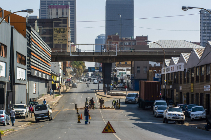 Municipal workers labour at a roadworks site in Johannesburg on May 7, 2020. MUST CREDIT: Bloomberg photo by Waldo Swiegers.
