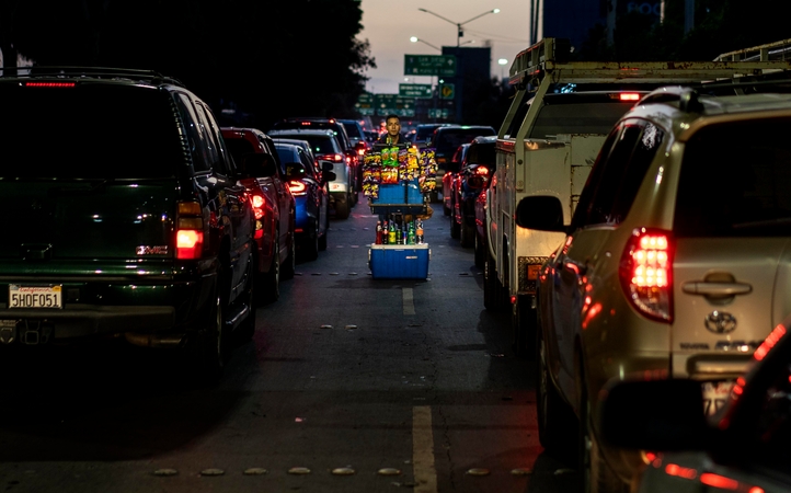 A vendor sells chips and soda during the Memorial Day weekend as long lines of cars wait to cross into the United States at the San Ysidro border crossing from Tijuana, Mexico, into the United States last month. MUST CREDIT: Washington Post photo by Melina Mara