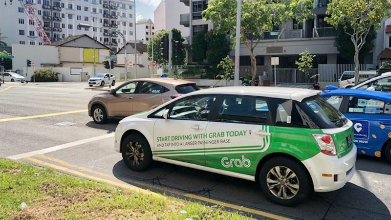 Demand for ride-hailing services, which is Grab's main business, has fallen amid the pandemic. ST PHOTO: DESMOND WEE