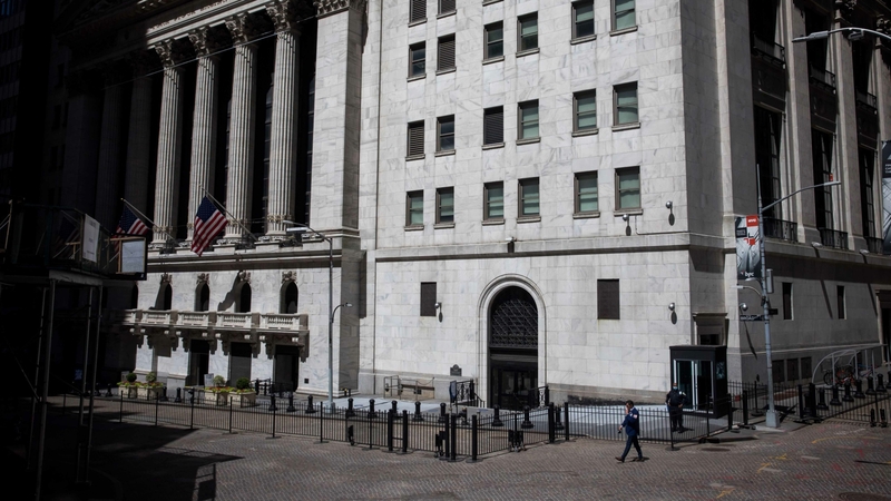A trader walks in front of the New York Stock Exchange in New York on June 17, 2020. MUST CREDIT: Bloomberg photo by Michael Nagle.