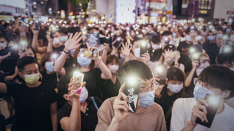 Demonstrators wearing protective masks shine lights from their smartphones during a protest in the Causeway Bay district of Hong Kong on June 12, 2020. MUST CREDIT: Bloomberg photo by Justin Chin.
Location: Hong Kong, Hong Kong