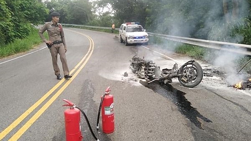Big bike catches fire after flipping on wet highway Big bike catches fire after flipping on wet highway