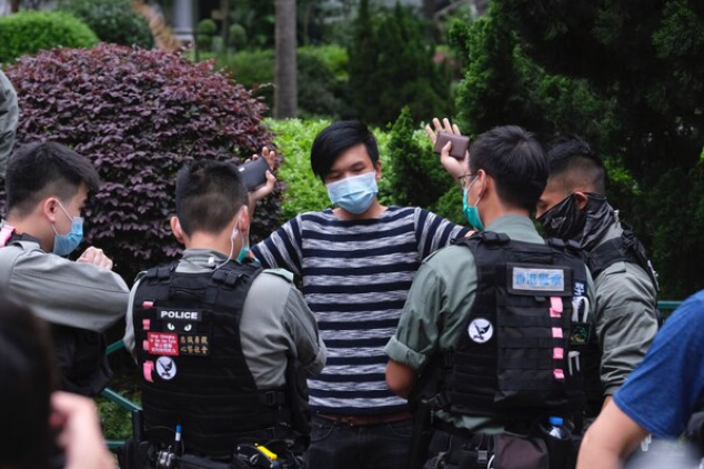 File photo: protester and police  in Hong Kong