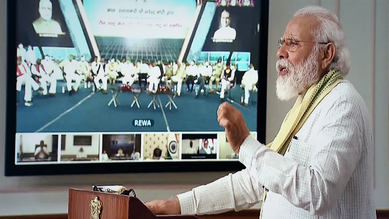 Prime Minister Narendra Modi dedicates to the nation a 750-megawatt ultra mega solar power plant set up at Rewa in Madhya Pradesh through video conference from Delhi. (Photo: Twitter | @BJP4India)