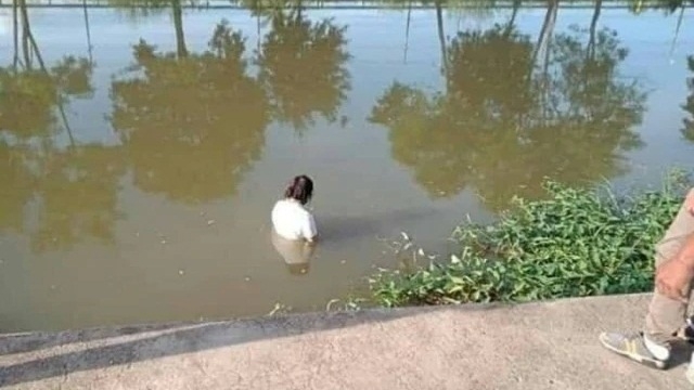 Woman meditating on life in canal has villagers worried Woman meditating on life in canal has villagers worried