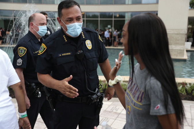 Art Acevedo, police chief in Houston and president of the Major Cities Chiefs Association greets people standing in line at George Floyd’s funeral. (Joe Raedle/Getty Images)