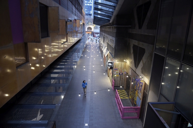 A woman walks along a deserted lane in the Queen Victoria Village precinct in Melbourne on July 16, 2020. MUST CREDIT: Bloomberg photo by Carla Gottgens.
Photo by: Carla Gottgens — Bloomberg
Location: Melbourne, Australia

